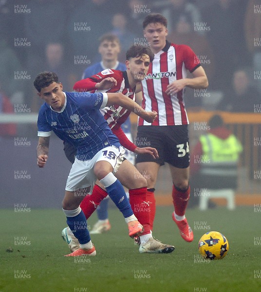 201225 - Lincoln City v Cardiff City - Sky Bet League 1 - Alex Robertson of Cardiff and Tom Bayliss of Lincoln