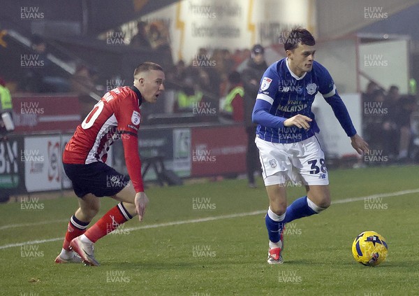 201225 - Lincoln City v Cardiff City - Sky Bet League 1 - Perry Ng of Cardiff and Jack Moylan of Lincoln