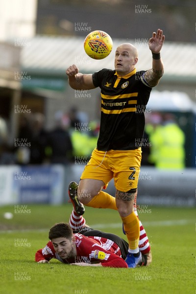 221218 - Lincoln City v Newport County - Sky Bet League 2 - David Pipe of Newport wins the ball