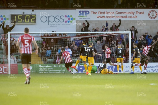 221218 - Lincoln City v Newport County - Sky Bet League 2 - John Akinde (29, far right) of Lincoln opens the scoring after two minutes