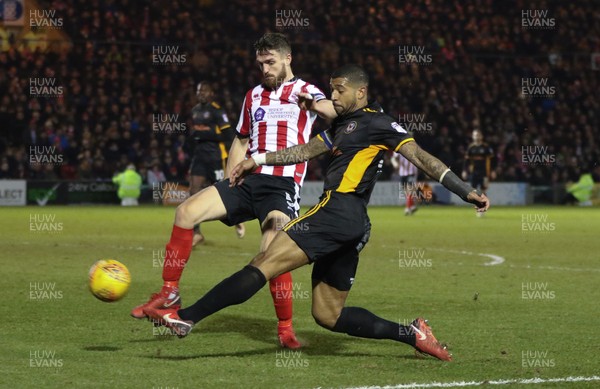 300118 - Lincoln City v Newport County, Sky Bet League 2 - Joss Labadie of Newport County looks to cross the ball past Luke Waterfall of Lincoln City
