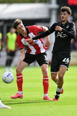 190926 - Lincoln City v Swansea City - Sky Bet Championship - Filip Lissah of Swansea City is challenged by Adam Reach of Lincoln
