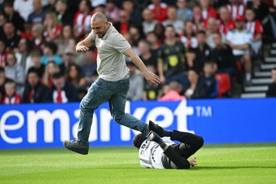190926 - Lincoln City v Swansea City - Sky Bet Championship - A Lincoln City supporter invades the pitch