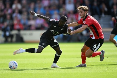 190926 - Lincoln City v Swansea City - Sky Bet Championship - Moussa Yeo of Swansea City is challenged by Ryley Towler of Lincoln