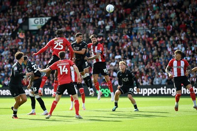 190926 - Lincoln City v Swansea City - Sky Bet Championship - Ben Cabango of Swansea City heads a shot on goal