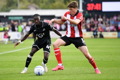 190926 - Lincoln City v Swansea City - Sky Bet Championship - Moussa Yeo of Swansea City is challenged by Adam Reach of Lincoln