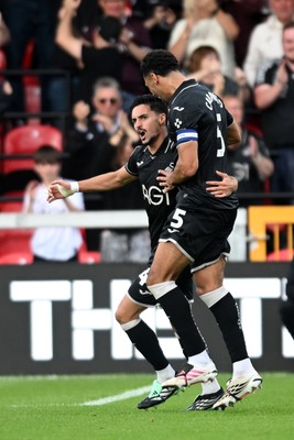 190926 - Lincoln City v Swansea City - Sky Bet Championship - Stephen Estaquio of Swansea City scores a goal to take the lead and celebrates towards the Swansea supporters