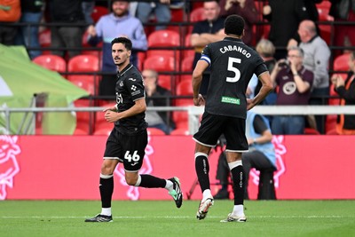 190926 - Lincoln City v Swansea City - Sky Bet Championship - Stephen Estaquio of Swansea City scores a goal to take the lead and celebrates towards the Swansea supporters
