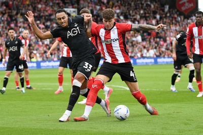 190926 - Lincoln City v Swansea City - Sky Bet Championship - Adam Idah of Swansea City is challenged by Andrei Coubiș of Lincoln