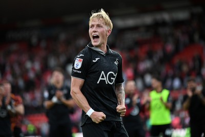 190926 - Lincoln City v Swansea City - Sky Bet Championship - Melker Widell of Swansea City celebrates the win at full time