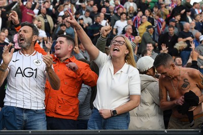 190926 - Lincoln City v Swansea City - Sky Bet Championship - Swansea fans celebrate the win at full time