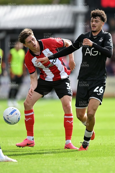 190926 - Lincoln City v Swansea City - Sky Bet Championship - Filip Lissah of Swansea City is challenged by Adam Reach of Lincoln