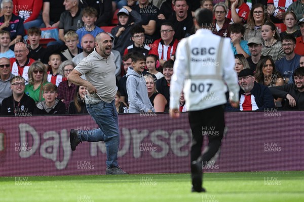190926 - Lincoln City v Swansea City - Sky Bet Championship - A Lincoln City supporter invades the pitch
