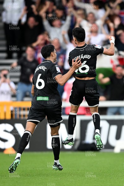 190926 - Lincoln City v Swansea City - Sky Bet Championship - Stephen Estaquio of Swansea City scores a goal to take the lead and celebrates towards the Swansea supporters