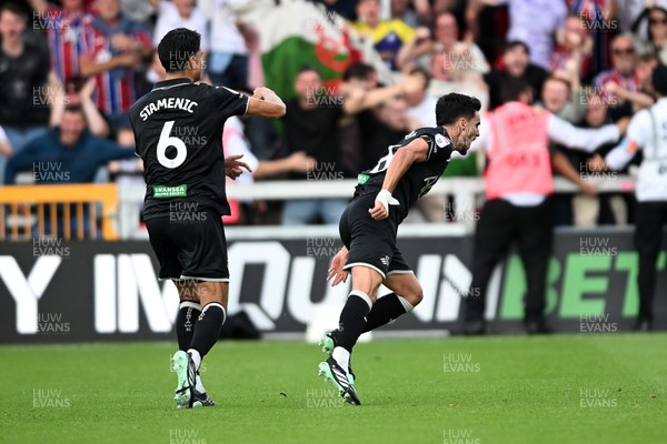 190926 - Lincoln City v Swansea City - Sky Bet Championship - Stephen Estaquio of Swansea City scores a goal to take the lead and celebrates towards the Swansea supporters