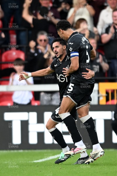 190926 - Lincoln City v Swansea City - Sky Bet Championship - Stephen Estaquio of Swansea City scores a goal to take the lead and celebrates towards the Swansea supporters