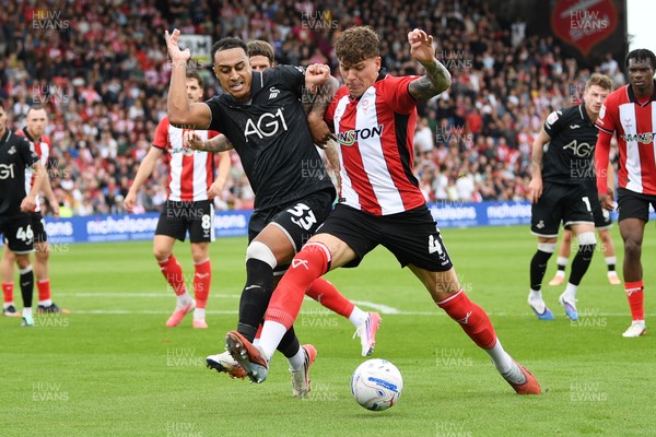 190926 - Lincoln City v Swansea City - Sky Bet Championship - Adam Idah of Swansea City is challenged by Andrei Coubiș of Lincoln