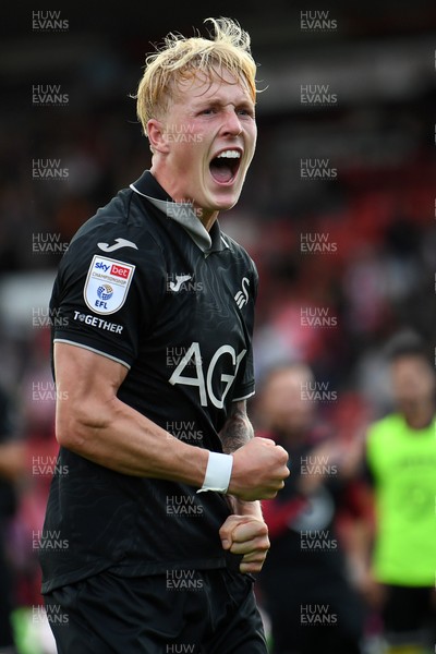 190926 - Lincoln City v Swansea City - Sky Bet Championship - Melker Widell of Swansea City celebrates the win at full time