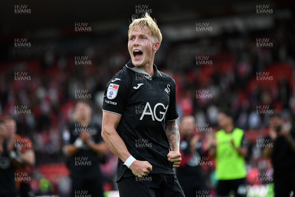 190926 - Lincoln City v Swansea City - Sky Bet Championship - Melker Widell of Swansea City celebrates the win at full time