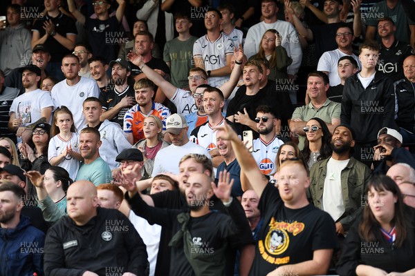 190926 - Lincoln City v Swansea City - Sky Bet Championship - Swansea fans celebrate the win at full time