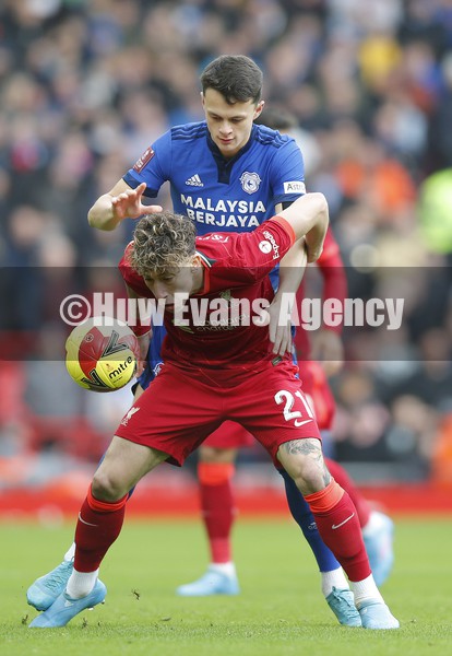 060222 - Liverpool v Cardiff City - FA Cup Fourth Round - Kostas Tsimikas of Liverpool and Perry Ng of Cardiff