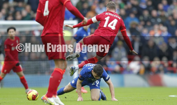 060222 - Liverpool v Cardiff City - FA Cup Fourth Round -Jordan Henderson of Liverpool falls over Mark Harris of Cardiff 