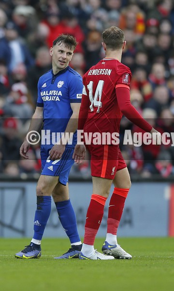 060222 - Liverpool v Cardiff City - FA Cup Fourth Round - Mark Harris of Cardiff has words with Jordan Henderson of Liverpool