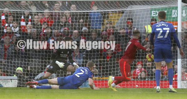 060222 - Liverpool v Cardiff City - FA Cup Fourth Round - Harvey Elliott of Liverpool scores the 3rd goal past Goalkeeper Dillon Phillips of Cardiff