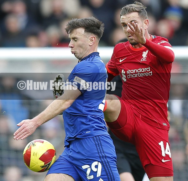 060222 - Liverpool v Cardiff City - FA Cup Fourth Round - Mark Harris of Cardiff and Jordan Henderson of Liverpool go for the ball