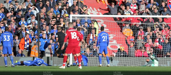 271018 - Liverpool v Cardiff - Premier League - Mohamed Salah of Liverpool scores the 1st goal leaving Cardiff on the deck