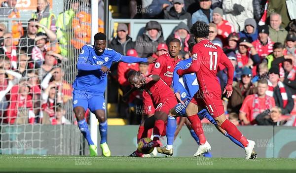 271018 - Liverpool v Cardiff - Premier League -  Bruno Ecuele Manga of Cardiff tries to defend against Sadio Mane of Liverpool