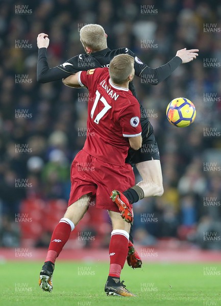 261217 - Liverpool v Swansea City - Premier League - Ragnar Klavan of Liverpool hugs Oliver McBurnie of Swansea in the 1st half