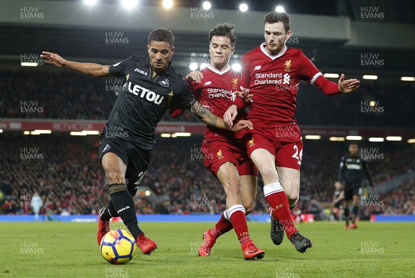 261217 - Liverpool v Swansea City - Premier League - Kyle Naughton of Swansea holds off Andy Robertson of Liverpool and Philippe Coutinho of Liverpool