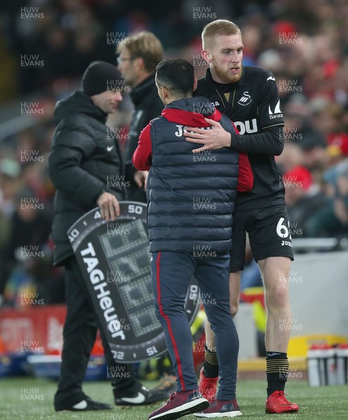 261217 - Liverpool v Swansea City - Premier League - Oliver McBurnie of Swansea is greeted by Leon Britton of Swansea as he comes off the pitch