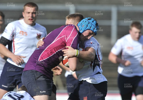 171012 - Llandovery College v Gower College -  WRU Colleges League - Gower College, left, are tackled by Llandovery College