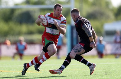 030525 - Llandovery RFC v Pontypool RFC - Super Rygbi Cymru Quarter Final - Adam Warren of Llandovery is challenged by Pat Lewis of Pontypool 