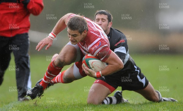 031112 - Llandovery v Bedwas - Principality Premiership -Matthew Jacobs of Llandovery is tackled by Richard Powell of Bedwas