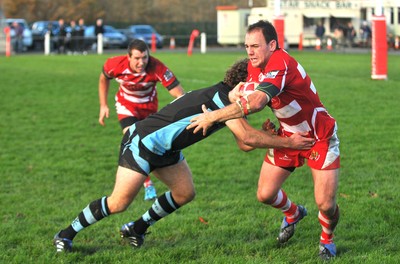 13.11.10. Llandovery v Cardiff- Principality Premiership Mike Sauro of Llandovery is tackled by James Loxton of Cardiff. 