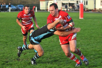 13.11.10. Llandovery v Cardiff- Principality Premiership Mike Sauro of Llandovery is tackled by James Loxton of Cardiff. 