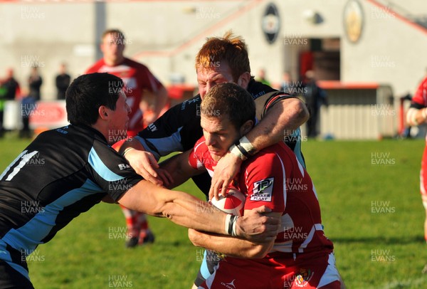 13.11.10. Llandovery v Cardiff- Principality Premiership. Dean Fitzgerald of Llandovery runs into trouble 