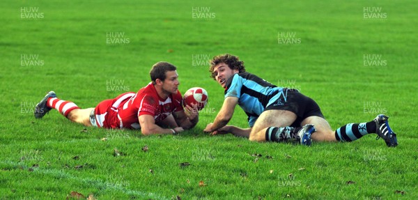 13.11.10. Llandovery v Cardiff- Principality Premiership. Cardiff full back  James Loxton scores try as Llandoverys Ifan Evans looks on. 