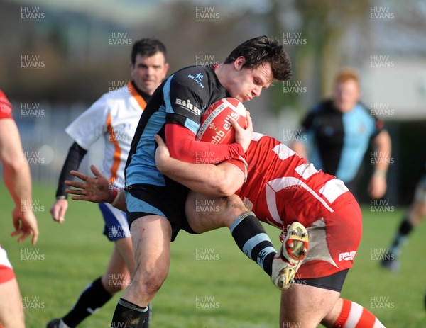 13.11.10. Llandovery v Cardiff- Principality Premiership. James Lewis of Cardiff is held by the Llandovery defence. 