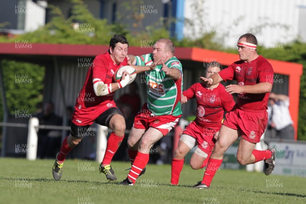 061012 - Llandovery v Llanelli - Welsh Premiership - Llanelli's Chris Keenan hands off Andrew Jones of Llandovery