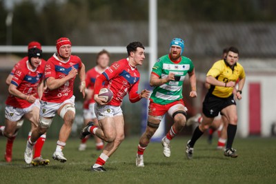 250323 - Llandovery v Llanelli - Indigo Group Premiership - Jac Davies of Llanelli on the attack