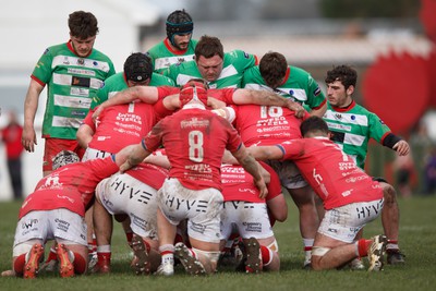 250323 - Llandovery v Llanelli - Indigo Group Premiership - The forwards pack down in a scrum