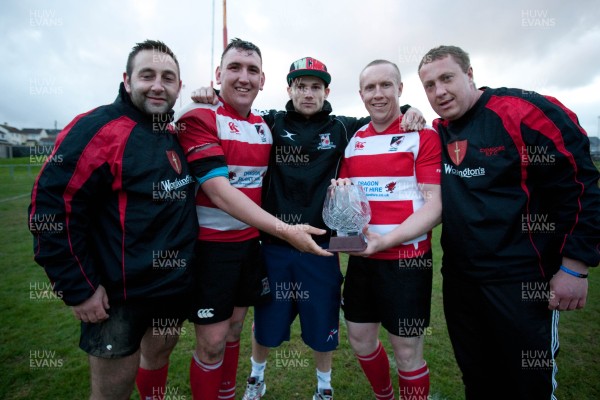 080513 - Llandybie v Cwmgors, SWALEC League 5 South West -Cwmgors celebrate winning the SWALEC League 5 South West Left to right, Jordan Davies, Rob Clive, Chris Jenkins, the boxer who has helped with training, Darren Howells and Lee Howells