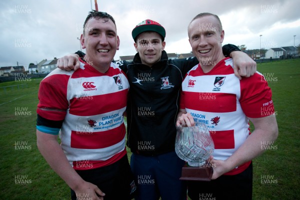 080513 - Llandybie v Cwmgors, SWALEC League 5 South West -Cwmgors celebrate winning the SWALEC League 5 South West Left to right, Rob Clive, Chris Jenkins, the boxer who has helped with training and Darren Howells