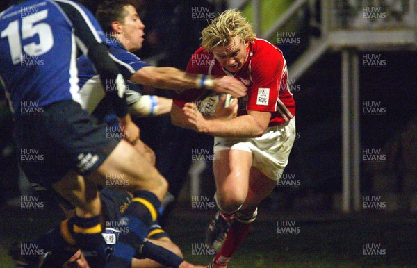 070106 - Llanelli Scarlets v Leinster - Celtic League -  Scarlets Alix Popham is tackled by Guy Easterby