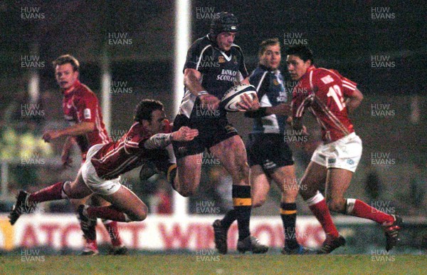 070106 - Llanelli Scarlets v Leinster - Celtic League -  Scarlets' Mark Jones tries to keep hold of Jamie Heaslip