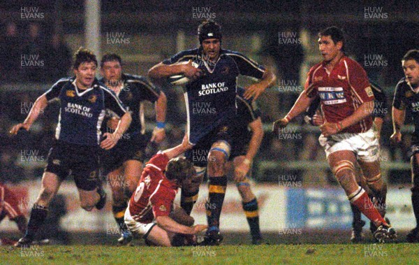 070106 - Llanelli Scarlets v Leinster - Celtic League -  Leinster's Adam Byrnes tries to get past Dwayne Peel